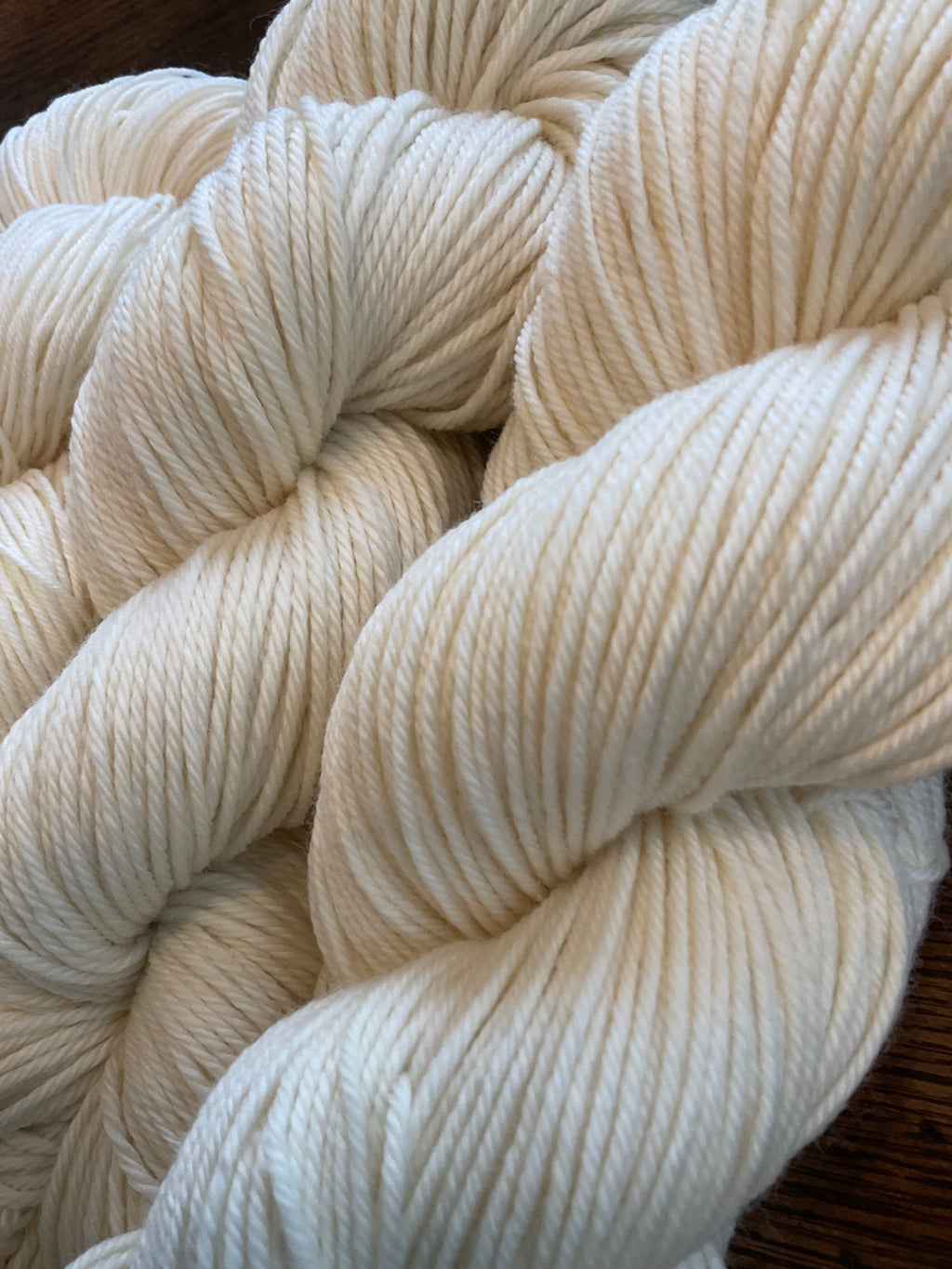 Close-up of a skein of cream-colored yarn